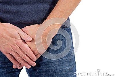 Man holding his urethra in pain. Men problems on white background. Medical concept Stock Photo
