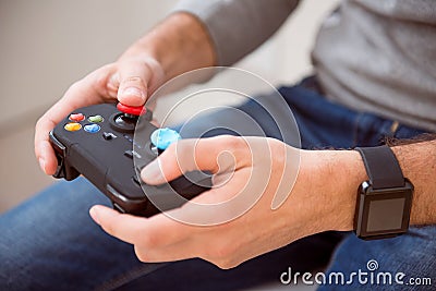 Man holding joystick of game console Stock Photo