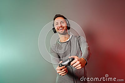 Man holding joystick and play virtual game Stock Photo