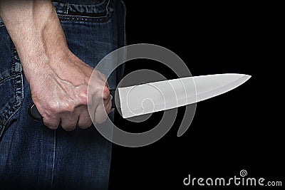 Man holding a knife in his hand Stock Photo