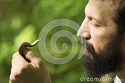 Man holding little snake Stock Photo