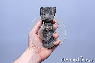 Man holding a luxury packaging of beard oil Stock Photo