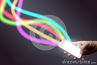 Man holding mobile phone and fiber optical light network. Stock Photo