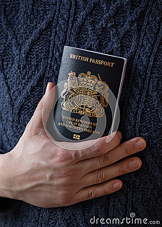 man holding new post Brexit blue British passport Devon, United Kingdom, January, 2021 Stock Photo