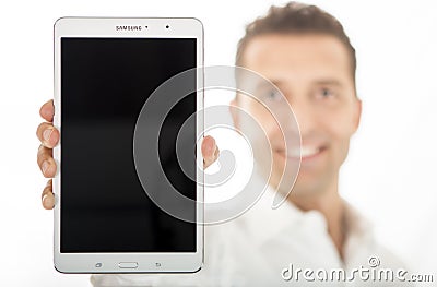 Man holding new Samsung Galaxy Tab Pro 8.4 16GB Editorial Stock Photo