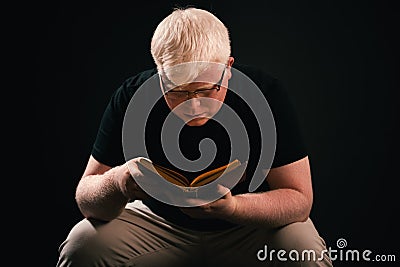 Man holding Open book in hands. Literature, knowledge, reading concept. Stock Photo