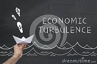 Economic turbulence concept on chalkboard Stock Photo