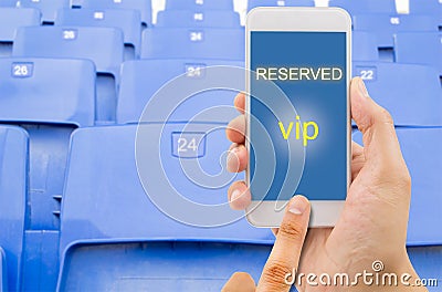 Reserving a seat with a phone Stock Photo