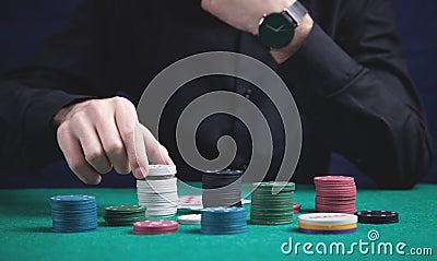 Man holding poker chips. Casino Stock Photo