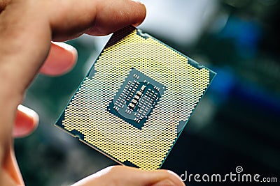 Man holding powerful CPU processor for computer Stock Photo