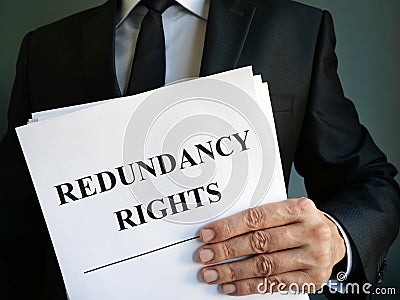 Man is holding Redundancy rights law Stock Photo