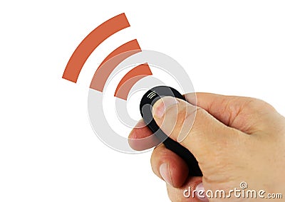 Man holding remote sensor in hand sending signal Stock Photo
