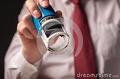 Man holding rubber stamp close up. Businessman certify documents Stock Photo