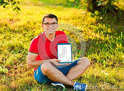 Man holding and shows touch screen tablet pc Stock Photo