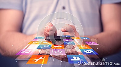 Man holding smart phone with colorful application icons Stock Photo