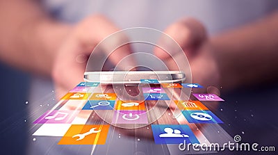 Man holding smart phone with colorful application icons Stock Photo