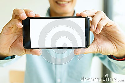 Man holding smartphone in hand. Business man showing smartphone Stock Photo