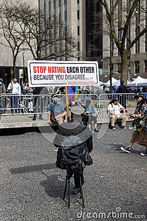 Man Holding a Stop Hate Sign Outside the Courthouse during the Trump Indictment in New York City Editorial Stock Photo