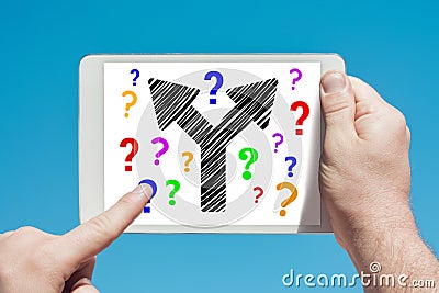 Man holding a tablet device showing two way arrow symbol concept Stock Photo