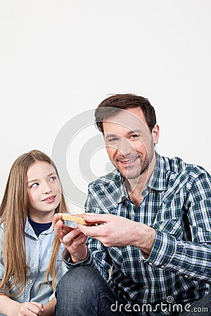 Man holding a toast for his daughter Stock Photo