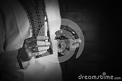 Man holding traditional ramadan food at night Stock Photo