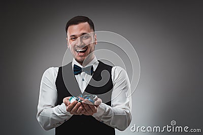 A man holding up poker chips. Poker Stock Photo