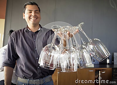 Man Holding Wine Glasses, Baja, Mexico Editorial Stock Photo