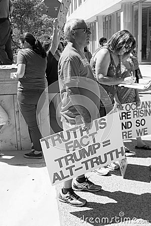Man Holds Anti Trump Protest Sign at a Rally in Columbus, OH. Editorial Stock Photo