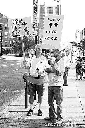 Man Holds Anti Trump Protest Sign at a Rally in Columbus, OH. Editorial Stock Photo