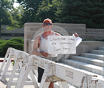 Man holds handwritten sign at Rally to Secure Our Borders Editorial Stock Photo