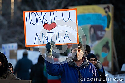 Man Holds Honk if you Love Antifa sign in Ottawa, Canada Editorial Stock Photo