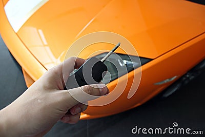 Man holds the key of a luxury car. Stock Photo