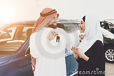 A man holds keys and smiles while makes a gift. Stock Photo