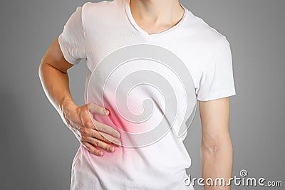 A man holds the liver. Pain in the abdomen. Cirrhosis Stock Photo