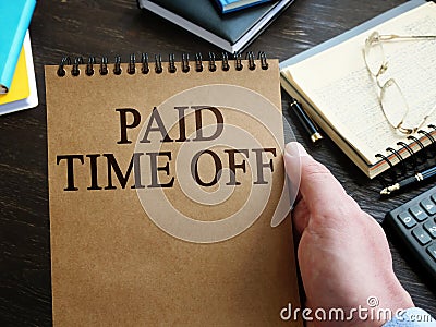 Man holds Paid Time Off PTO policy Stock Photo