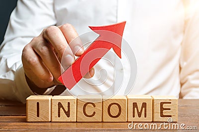 A man holds a red arrow over the words profit. Development of approaches and optimization of business processes to improve Stock Photo