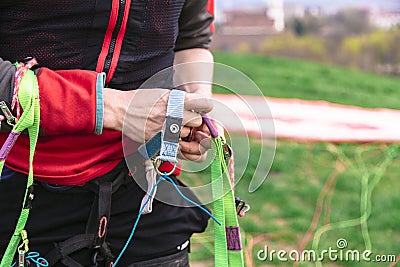 Man holds slings of parachute in hands close up Stock Photo