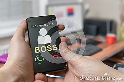 Man holds smartphone in hands with incoming call from boss Stock Photo