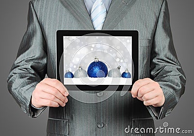 Man holds tablet PC with Christmas composition Stock Photo