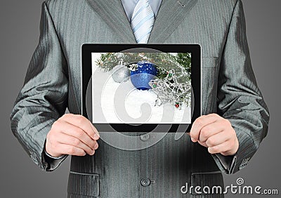 Man holds tablet PC with Christmas composition Stock Photo