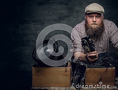 A man holds vintage camera. Stock Photo