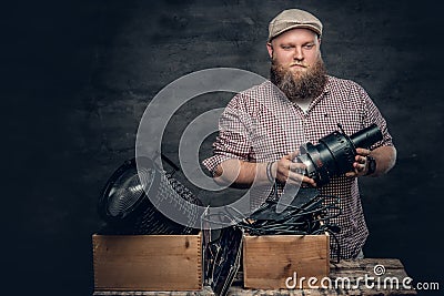 A man holds vintage camera. Stock Photo