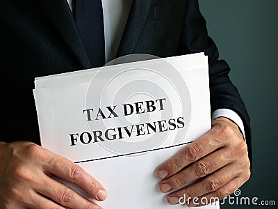 Man holds Tax debt forgiveness agreement Stock Photo