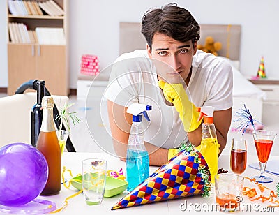 Man at home after heavy partying Stock Photo