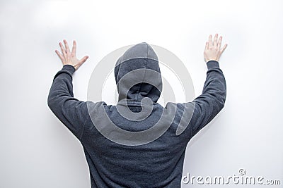 Man in hood with raised hands Stock Photo