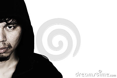 man in hood with scary face Stock Photo