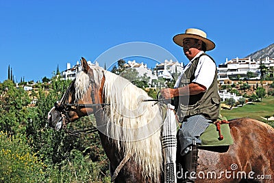 Man on horse, Romeria San Bernabe, Marbella, Spain. Editorial Stock Photo