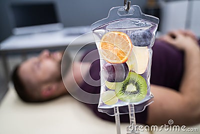 Fruit Slices Inside Saline Bag Hanging In Hospital Stock Photo