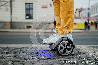 Man with hoverboard on the street Stock Photo