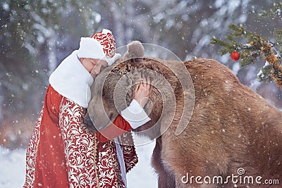 Man hugs brown bear in Christmas eve Editorial Stock Photo